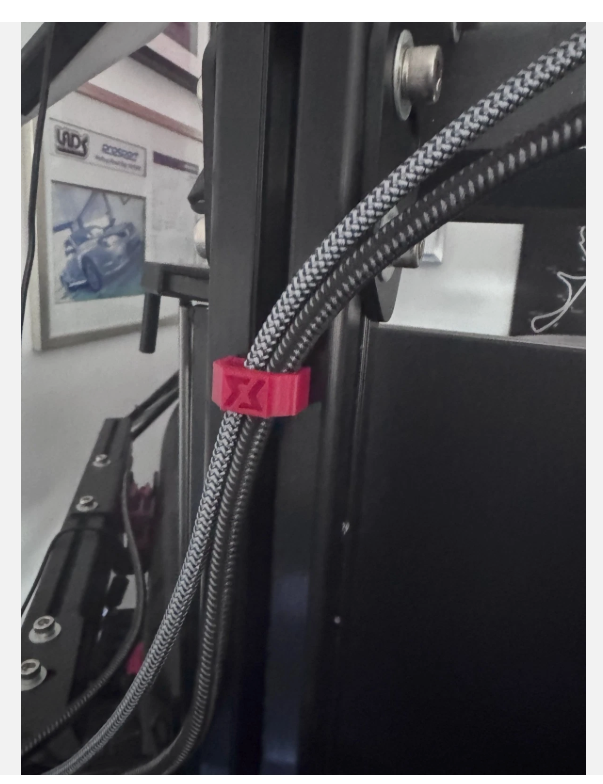 Widdowmaker cable clip installed on an aluminium-profile sim rig